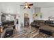 Spacious living room with hardwood floors, ample seating, and an open layout at 3303 Blue Grass Cir, Castle Rock, CO 80109