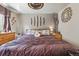 Main bedroom featuring a ceiling fan and decorative wall fixtures at 3303 Blue Grass Cir, Castle Rock, CO 80109