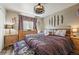 Main bedroom featuring a ceiling fan and decorative wall fixtures at 3303 Blue Grass Cir, Castle Rock, CO 80109
