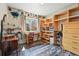 Office with shelves, wood-look flooring, desk, and a window letting in natural light at 3303 Blue Grass Cir, Castle Rock, CO 80109