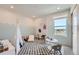 bedroom featuring a large window, playful wall art, and plenty of space to play and grow at 6880 Bryant Way, Denver, CO 80221