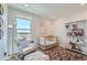 Cozy Bedroom with designer wallpaper, natural light, comfortable seating, and playful decor at 6880 Bryant Way, Denver, CO 80221