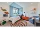 Stylish bedroom with playful decor, a comfortable single bed, and lots of natural light at 6880 Bryant Way, Denver, CO 80221