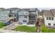Spacious backyard with a patio, artificial turf, gardening area, and a classic white picket fence at 7012 S Undergrove Way, Aurora, CO 80016