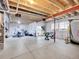 Unfinished basement with exposed beams and utilities offering potential for customization and extra living space at 7012 S Undergrove Way, Aurora, CO 80016