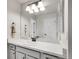 Bright bathroom with white marble countertops, neutral tones, and modern fixtures, exuding elegance at 7012 S Undergrove Way, Aurora, CO 80016