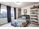 A playful bedroom with themed decor and plenty of shelving for displaying toys and collectibles at 7012 S Undergrove Way, Aurora, CO 80016