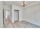 Bedroom with hardwood floors, closet, and modern light fixture at 1304 Snowberry # 204, Louisville, CO 80027