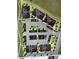 Community map showcasing building layouts, parking areas, trees, and community spaces within the neighborhood at 1304 Snowberry # 204, Louisville, CO 80027