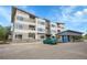Modern condo complex with ample parking, covered parking spaces, and well-maintained landscaping at 1304 Snowberry # 204, Louisville, CO 80027