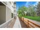 Modern exterior of townhome showcasing the sidewalk, with grass and trees, enhancing its curb appeal and community feel at 1304 Snowberry # 204, Louisville, CO 80027