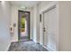 Apartment hallway with door to unit, exit to outside and neutral color palette at 1304 Snowberry # 204, Louisville, CO 80027
