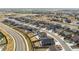 An expansive aerial view of the neighborhood, showcasing homes, streets, and green spaces at 8374 E 132Nd Pl, Thornton, CO 80602