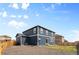Back exterior view showing the home's siding, windows, and access to the backyard at 8374 E 132Nd Pl, Thornton, CO 80602