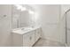 Well-lit bathroom with double sinks, stylish vanity, and a sleek glass-enclosed shower offering modern comfort at 8374 E 132Nd Pl, Thornton, CO 80602