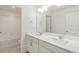 Modern bathroom featuring double sinks, ample lighting, and a shower-tub combo at 8374 E 132Nd Pl, Thornton, CO 80602