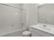 Bright bathroom featuring a shower and bath and a modern vanity at 8374 E 132Nd Pl, Thornton, CO 80602