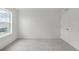 Bright bedroom with neutral carpet and a large window offering comfortable living space at 8374 E 132Nd Pl, Thornton, CO 80602