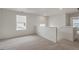 Bright bonus room with neutral carpet, ample natural light, and a view of the neighborhood at 8374 E 132Nd Pl, Thornton, CO 80602
