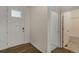 Bright entryway featuring a modern front door and views into the bathroom at 8374 E 132Nd Pl, Thornton, CO 80602