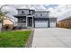 Beautiful two-story home featuring a two car garage, landscaped yard and a charming covered front porch at 8374 E 132Nd Pl, Thornton, CO 80602