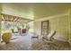 Enjoy outdoor living in this covered patio area with brick pavers and comfortable seating at 5475 W Ottawa Ave, Littleton, CO 80128