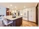 Spacious kitchen featuring a large center island and updated stainless appliances at 5475 W Ottawa Ave, Littleton, CO 80128