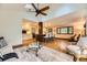 Open concept living space with kitchen, island seating, and lots of natural light at 5475 W Ottawa Ave, Littleton, CO 80128