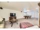 Spacious living area featuring a TV, a billiard table, and comfortable seating at 5475 W Ottawa Ave, Littleton, CO 80128