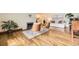 Bright living room featuring hardwood floors, fireplace, and stylish furnishings at 5475 W Ottawa Ave, Littleton, CO 80128