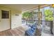Relax on this covered patio with comfortable seating and stylish decor at 5475 W Ottawa Ave, Littleton, CO 80128