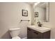 Modern half bath with a sleek vanity, contemporary fixtures, and a clean, minimalist design at 5657 Jaguar Way, Lone Tree, CO 80124