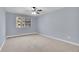A large bedroom featuring a ceiling fan and a window at 710 S Clinton St # 6A, Denver, CO 80247