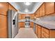Close up of the kitchen featuring stainless steel appliances and tile backsplash at 710 S Clinton St # 6A, Denver, CO 80247