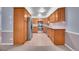 Updated kitchen with stainless steel appliances, tile backsplash, and granite counters at 710 S Clinton St # 6A, Denver, CO 80247