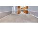 Open living room with neutral walls and convenient access to the kitchen at 710 S Clinton St # 6A, Denver, CO 80247