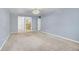Large carpeted bedroom with walk in closet and ensuite bathroom at 710 S Clinton St # 6A, Denver, CO 80247