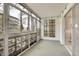 Bright sunroom with many windows and unique brick design at 710 S Clinton St # 6A, Denver, CO 80247