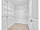 Walk-in closet with white walls, carpeted flooring and metal shelving at 710 S Clinton St # 6A, Denver, CO 80247