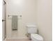 Neat bathroom with a white toilet and towel rack at 14001 E Marina Dr # 606, Aurora, CO 80014