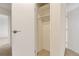 A closet in a bedroom offers storage space with a hanging rod and open door at 14001 E Marina Dr # 606, Aurora, CO 80014