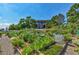 Community garden featuring raised beds, various plants, and flowers enhances the community's appeal at 14001 E Marina Dr # 606, Aurora, CO 80014