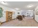 Common area featuring seating, bookshelves, and elevator access, with a welcoming and well-lit ambiance at 14001 E Marina Dr # 606, Aurora, CO 80014