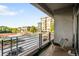 Open-air balcony with seating offering city and neighborhood views on a sunny day at 333 S Monroe St # 211, Denver, CO 80209
