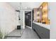 Modern bathroom with walk-in shower, double sink vanity, and sleek design at 333 S Monroe St # 211, Denver, CO 80209