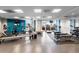 Well-equipped gym with modern exercise machines, weights, and a rubber floor mat at 333 S Monroe St # 211, Denver, CO 80209
