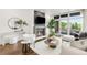 Elegant living room features a fireplace, modern decor, and abundant natural light at 333 S Monroe St # 211, Denver, CO 80209
