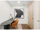 Home office with desk, chair, and modern artwork at 333 S Monroe St # 211, Denver, CO 80209