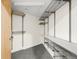 Walk-in closet with custom shelving and ample storage space at 333 S Monroe St # 211, Denver, CO 80209
