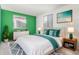 Spacious bedroom with a green accent wall and ample storage at 6338 W 92Nd Pl, Westminster, CO 80031